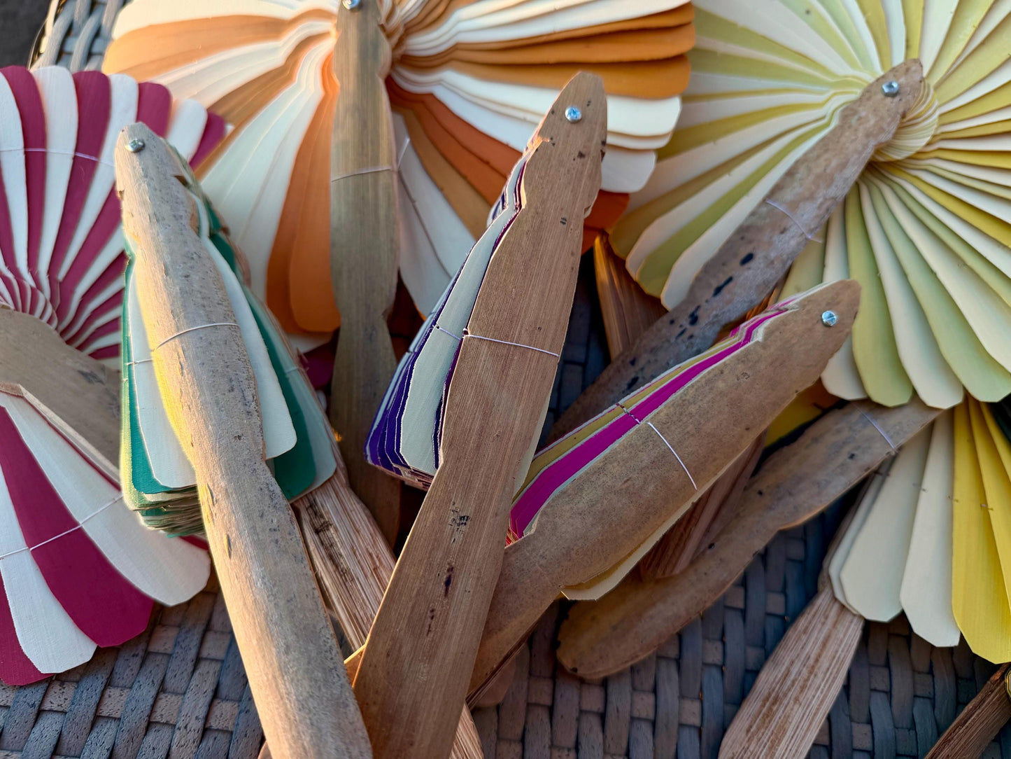 Absolutely beautiful eco friendly handheld bamboo fans. A wide range of colours. Large handmade fans. Eco gifts. Red, orange, green, purple.